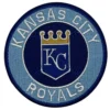 This Round embroidered Kansas City Royals vintage round logo patch showcasing a dark navy center shield with white KC initials and gold crown, enclosed by a light blue ring reading Kansas City Royals.